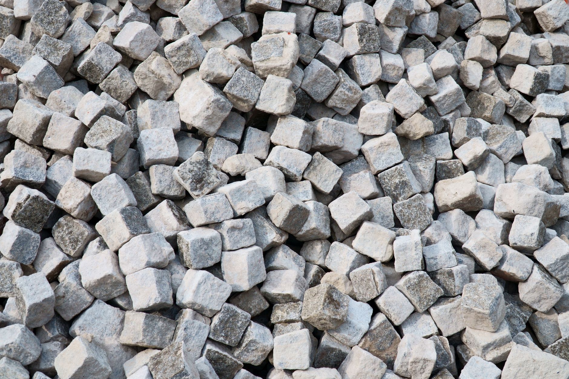 Heap of gray stone cubes ideal for construction projects and landscaping designs.