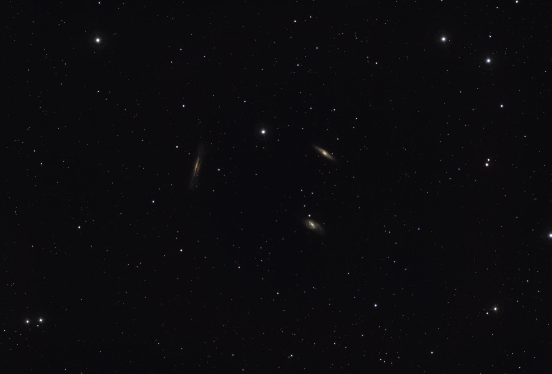 A breathtaking view of distant galaxies amidst a starry night sky filled with countless stars.